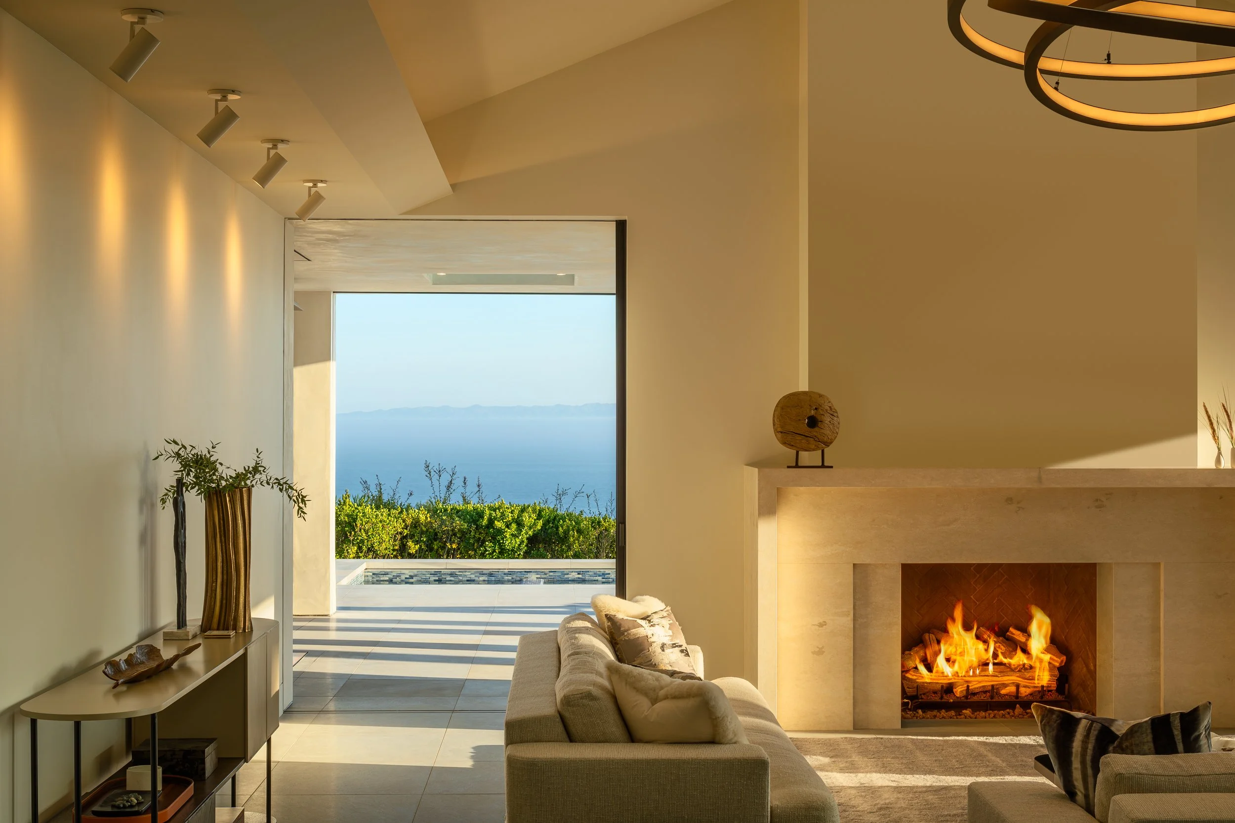 Modern living room with fireplace and ocean view