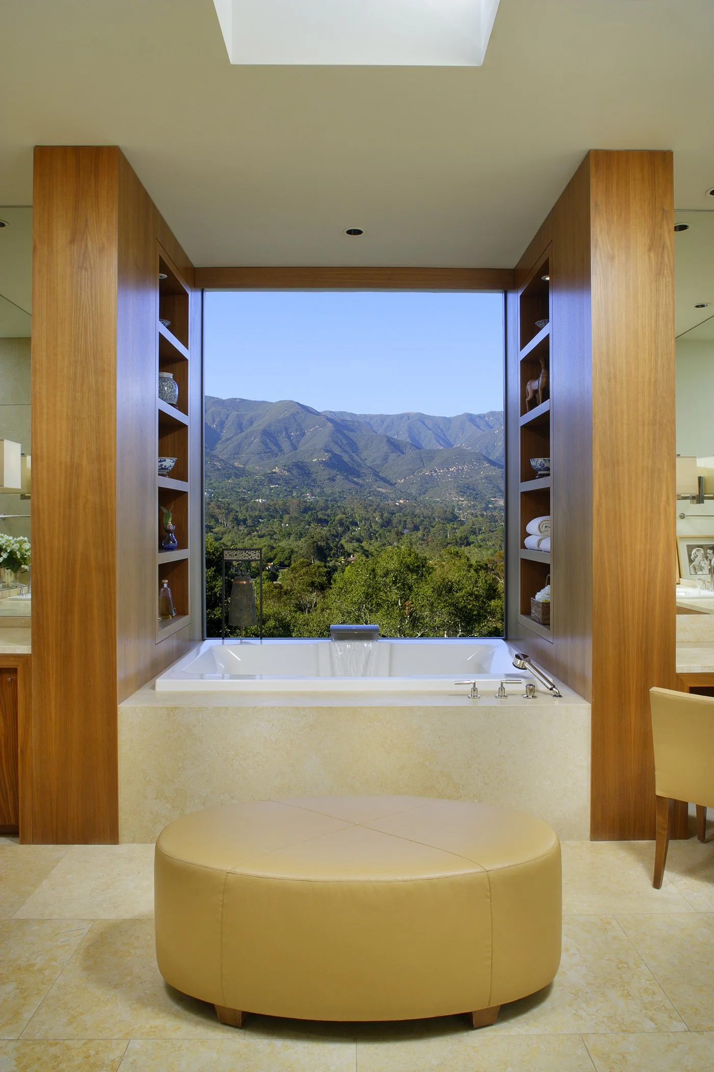Luxury bathroom with a modern bathtub offering stunning mountain views.