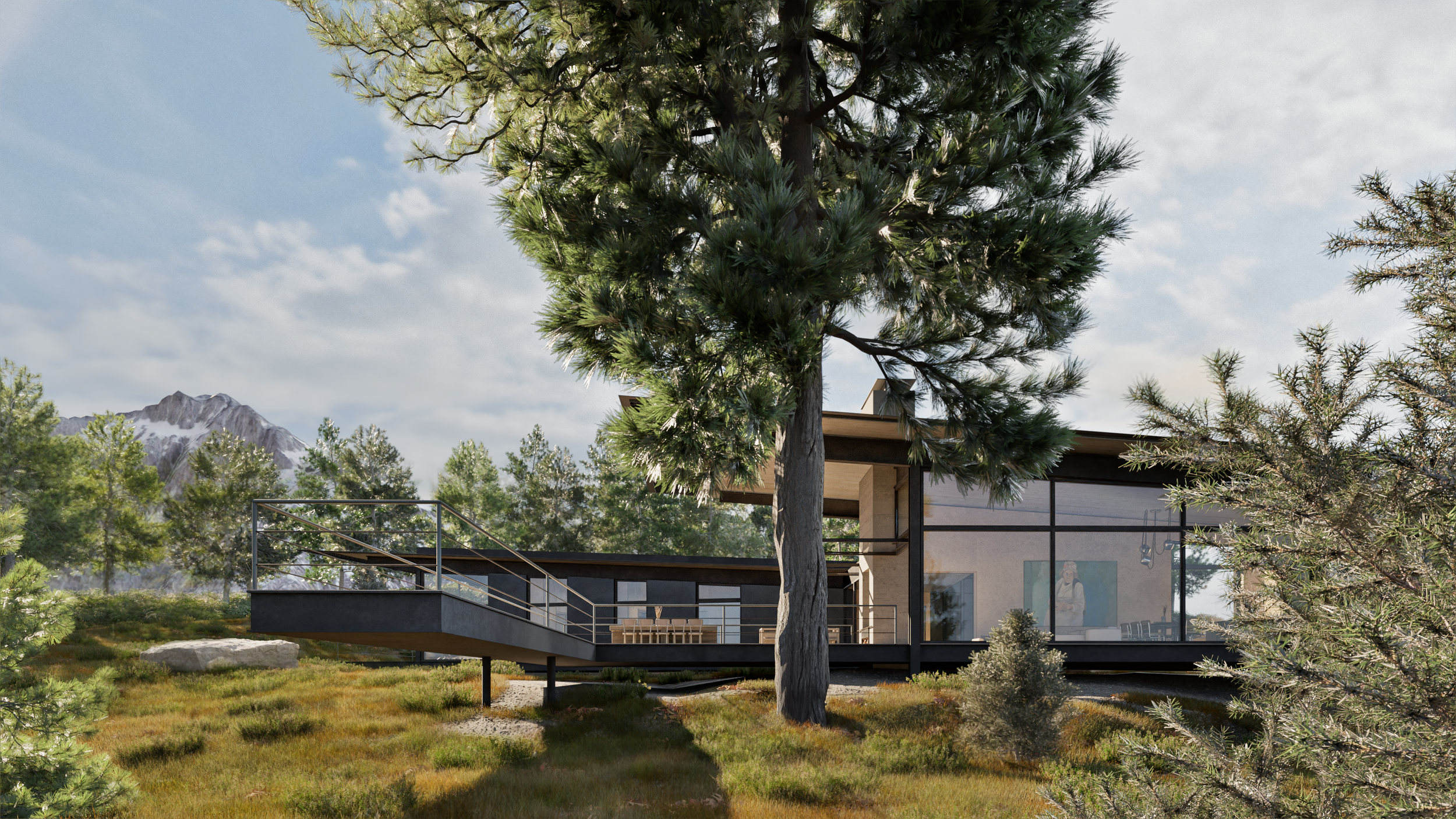 Modern house with glass walls surrounded by trees and mountains.